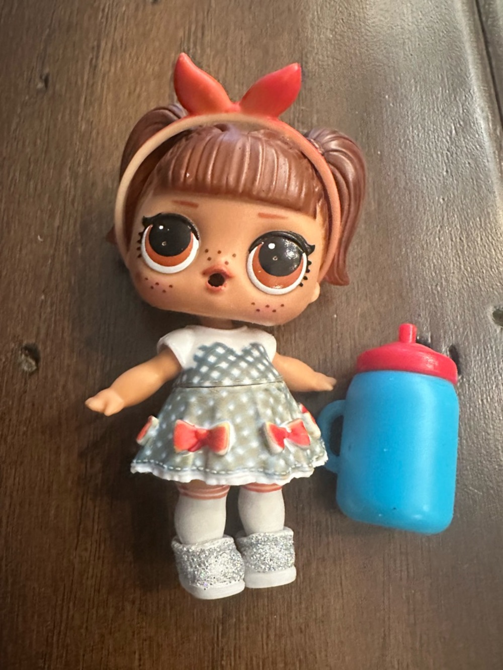 EUC L.O.L. Surprise! Brown-Haired Doll with Blue Bottle and Red Accents